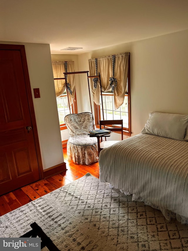 bedroom featuring wood-type flooring