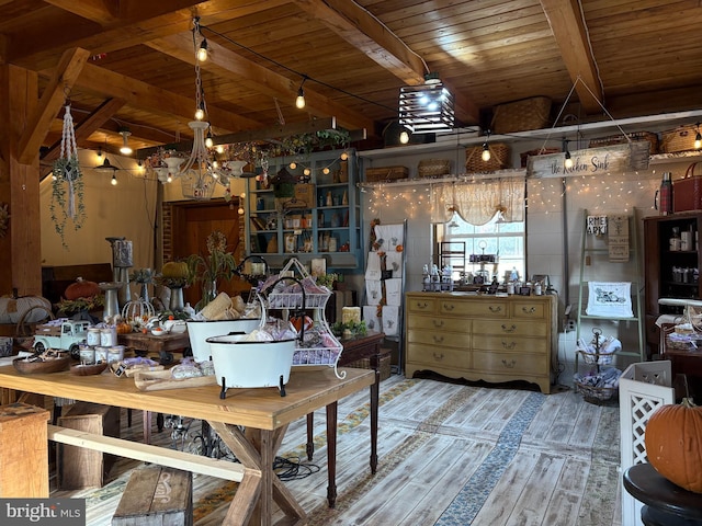 misc room featuring hardwood / wood-style flooring, beam ceiling, wood ceiling, and an inviting chandelier