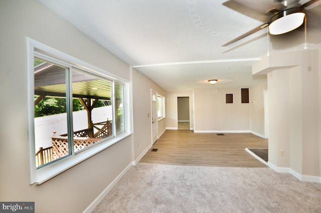 empty room featuring ceiling fan and light hardwood / wood-style floors