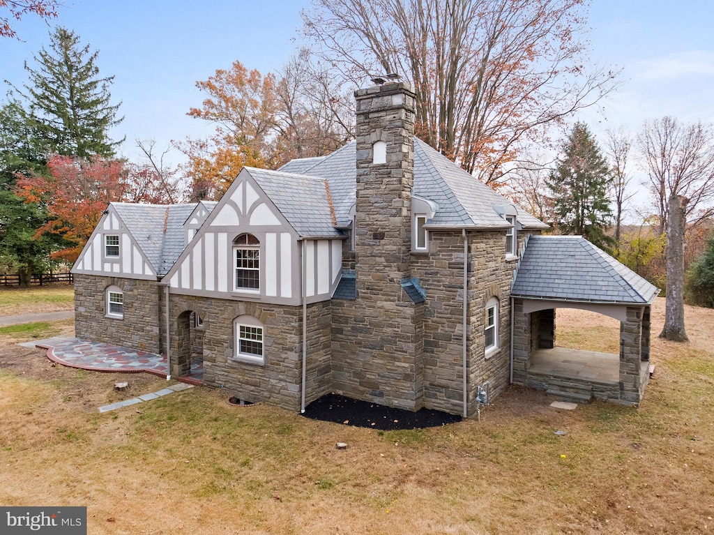 view of home's exterior featuring a lawn