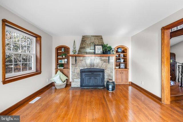 unfurnished living room with hardwood / wood-style floors