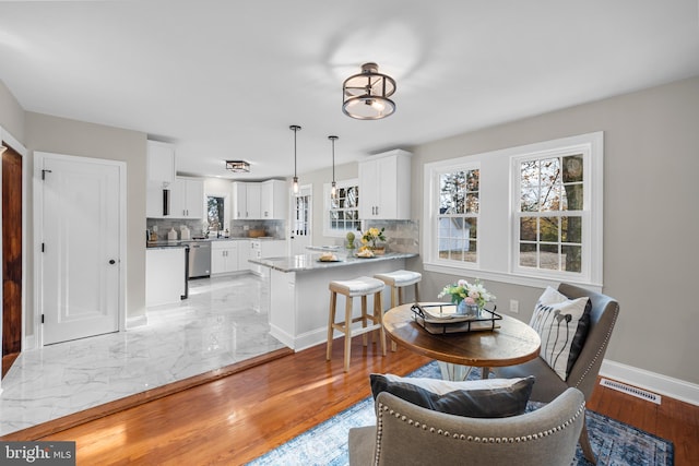 dining room featuring light wood-type flooring