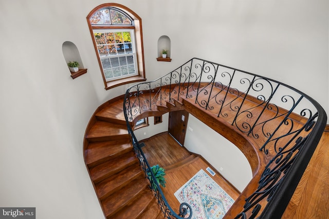 staircase featuring hardwood / wood-style floors