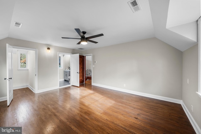 interior space with ceiling fan, wood-type flooring, and vaulted ceiling