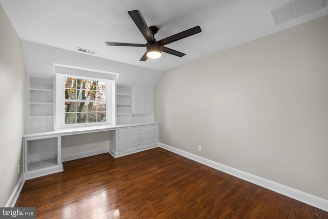 unfurnished office with ceiling fan, lofted ceiling, and dark wood-type flooring