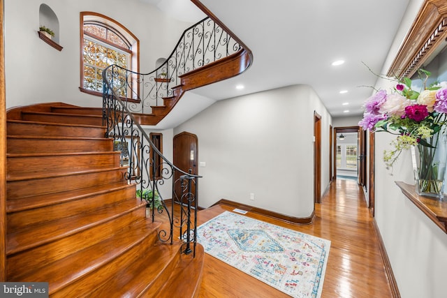 foyer entrance with light hardwood / wood-style flooring