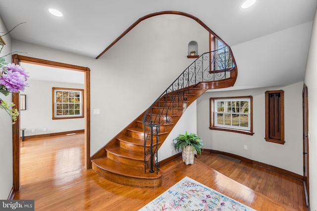 staircase with wood-type flooring