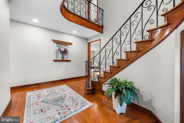 stairway featuring hardwood / wood-style flooring