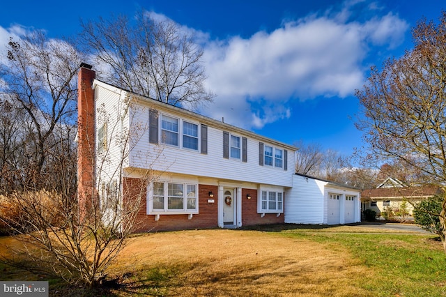 view of front of house featuring a front yard and a garage