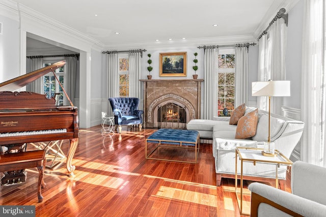 sitting room featuring hardwood / wood-style flooring and crown molding