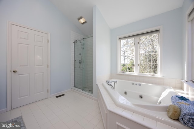 bathroom with visible vents, vaulted ceiling, a stall shower, tile patterned floors, and a whirlpool tub