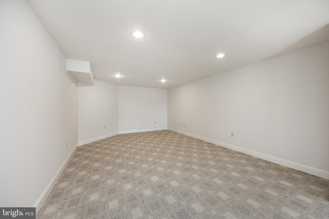 finished below grade area with recessed lighting, carpet flooring, and baseboards