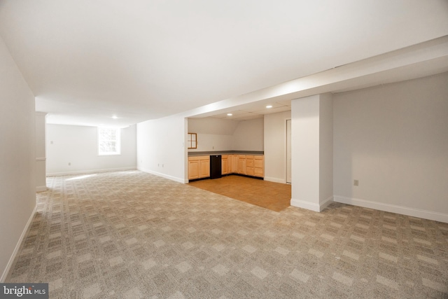 basement with recessed lighting, baseboards, and light carpet