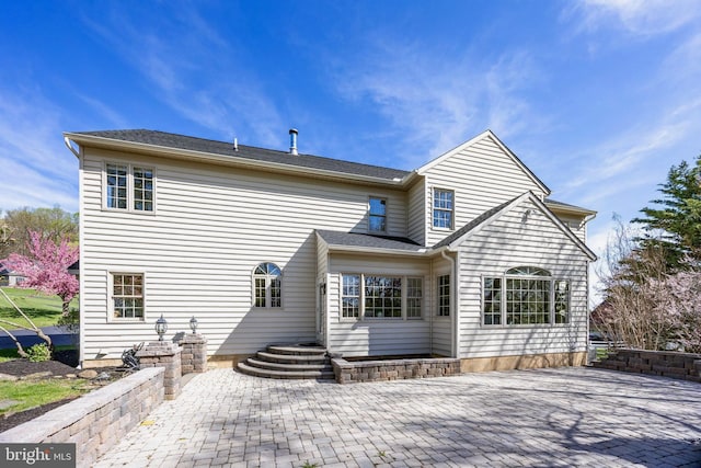rear view of house featuring a patio