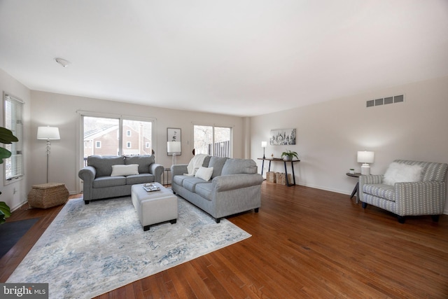 living room with dark hardwood / wood-style floors