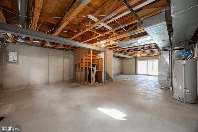 basement featuring heating unit and gas water heater