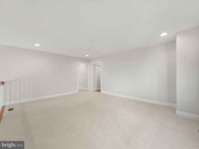 empty room with light colored carpet