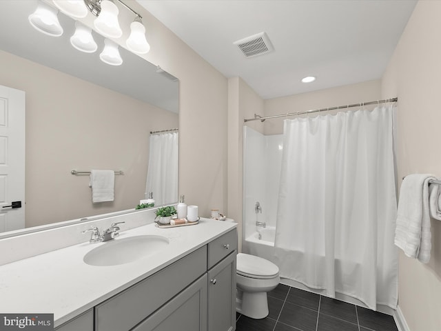 full bathroom featuring tile patterned floors, shower / bath combination with curtain, toilet, and vanity