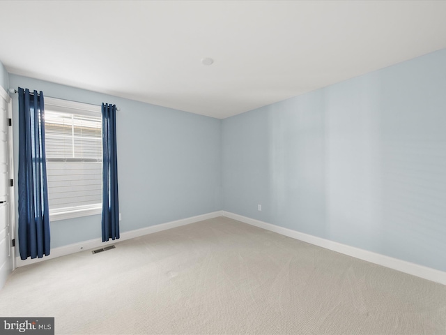 view of carpeted spare room