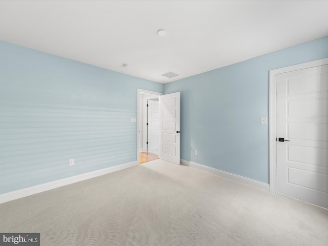 unfurnished bedroom with light carpet