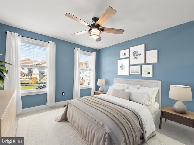 carpeted bedroom featuring ceiling fan