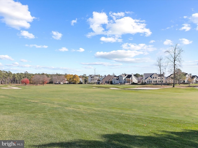 view of home's community with a lawn