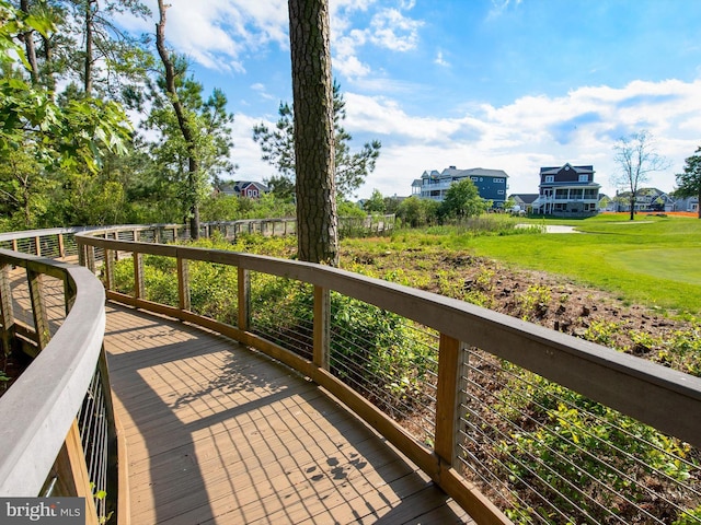 wooden deck with a yard