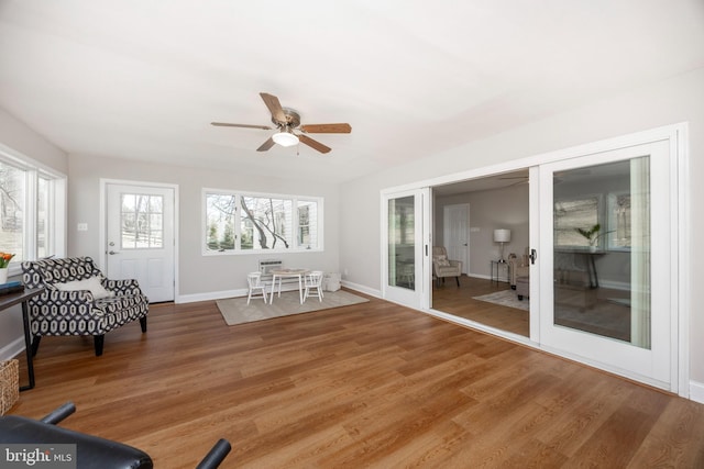 sunroom with french doors and ceiling fan