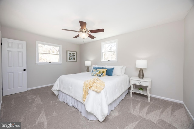 carpeted bedroom with baseboards and ceiling fan