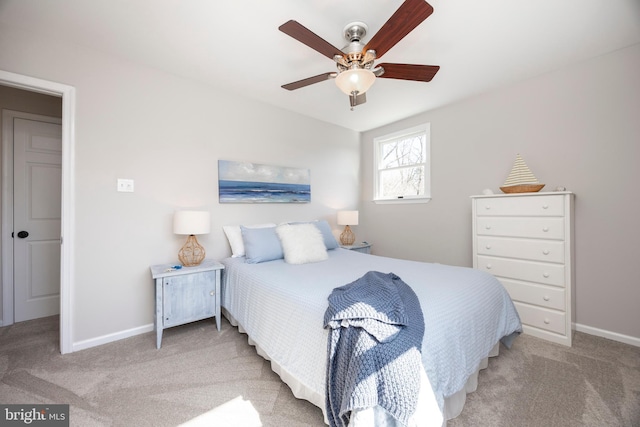 bedroom featuring baseboards, carpet floors, and ceiling fan