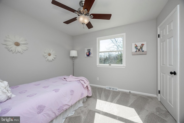 bedroom featuring visible vents, baseboards, ceiling fan, and carpet flooring