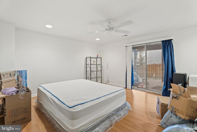 bedroom with access to exterior, ceiling fan, and light wood-type flooring