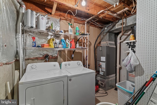 laundry area featuring washing machine and clothes dryer