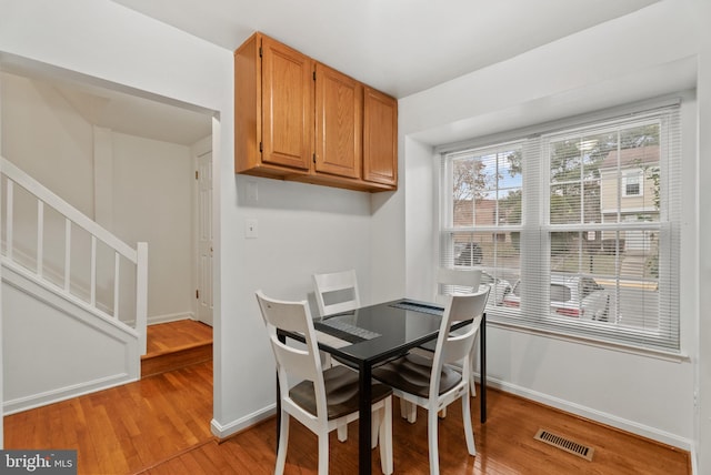 dining space featuring light hardwood / wood-style flooring