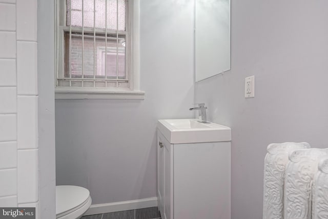 bathroom with vanity and toilet