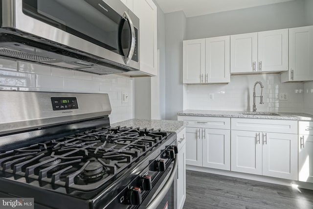 kitchen with white cabinetry and stainless steel appliances