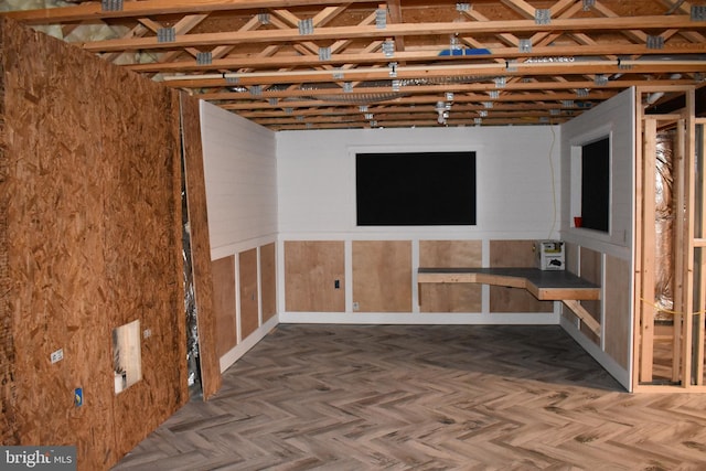 basement featuring parquet floors