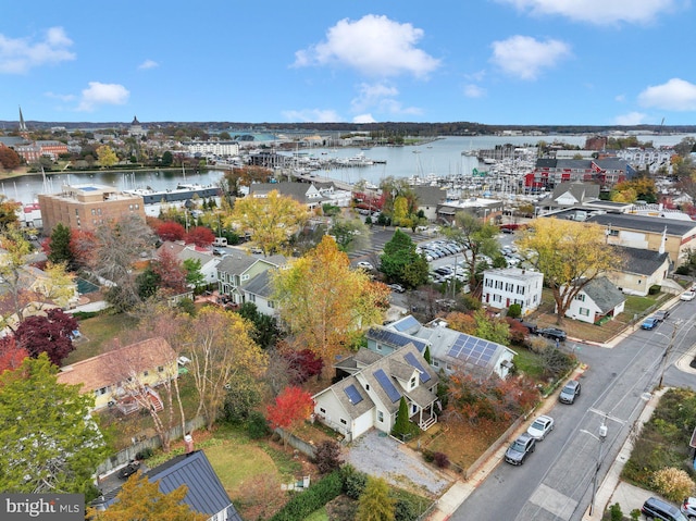 birds eye view of property with a water view