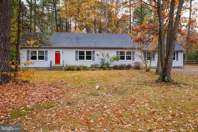 ranch-style home featuring a front yard