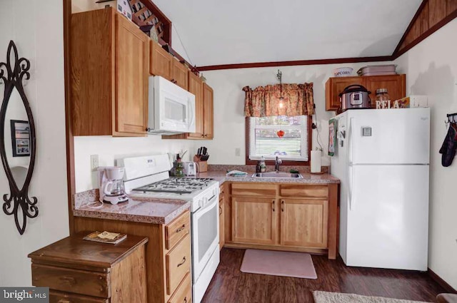 kitchen with sink, hanging light fixtures, dark hardwood / wood-style floors, lofted ceiling, and white appliances