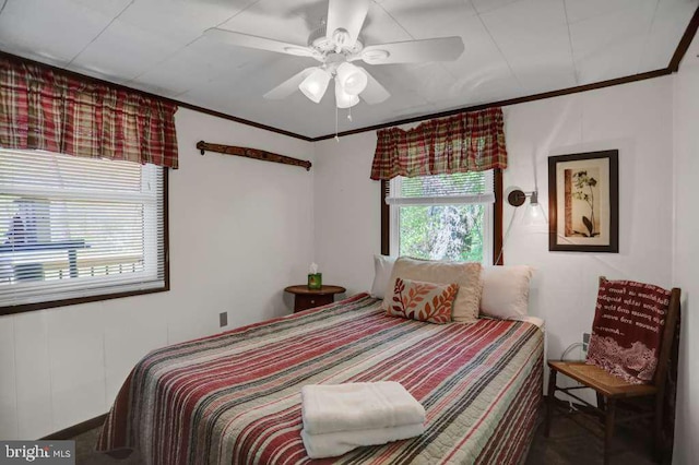 bedroom with ceiling fan and ornamental molding