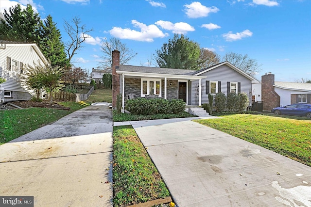 view of front of home featuring a front yard and a porch