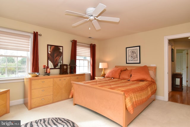 carpeted bedroom with ceiling fan