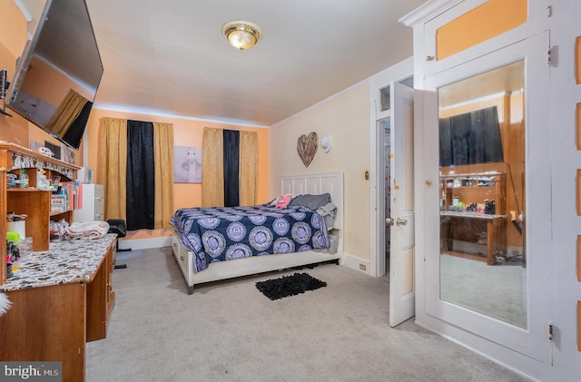 carpeted bedroom with crown molding