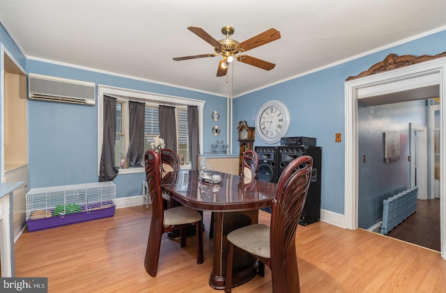 dining space featuring radiator, ceiling fan, crown molding, wood-type flooring, and an AC wall unit