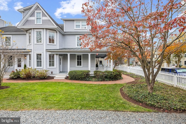 view of front of home with a front lawn and a porch