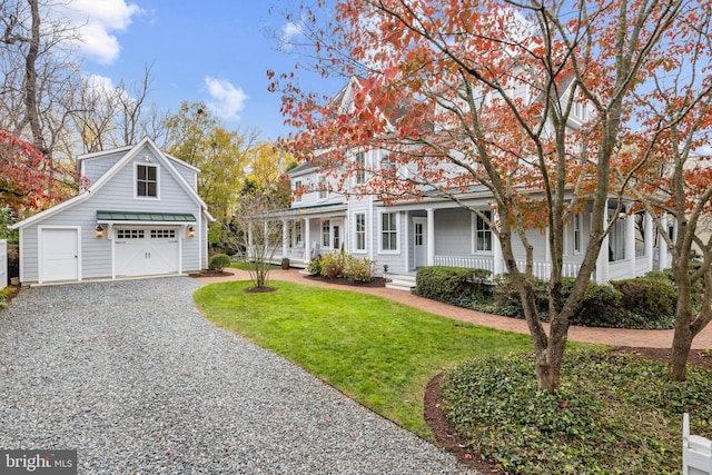 view of front of property with covered porch and a front yard