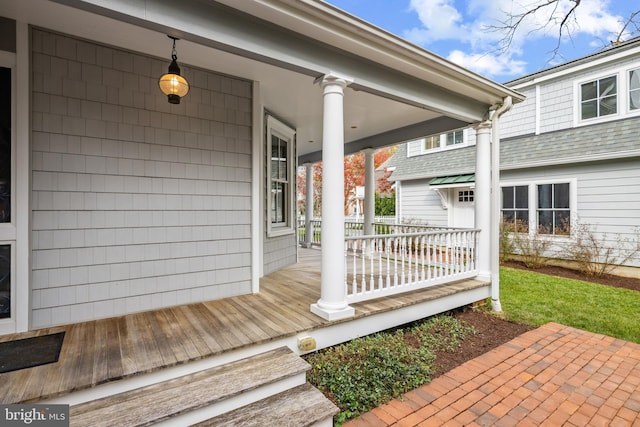 wooden terrace featuring a porch