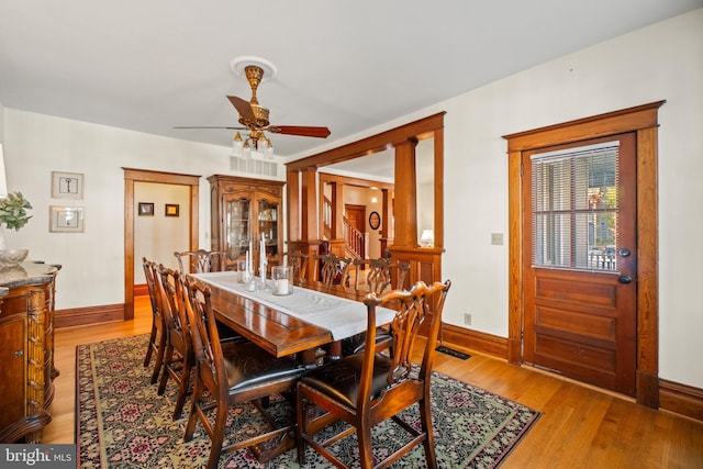 dining room with ceiling fan and light wood-type flooring