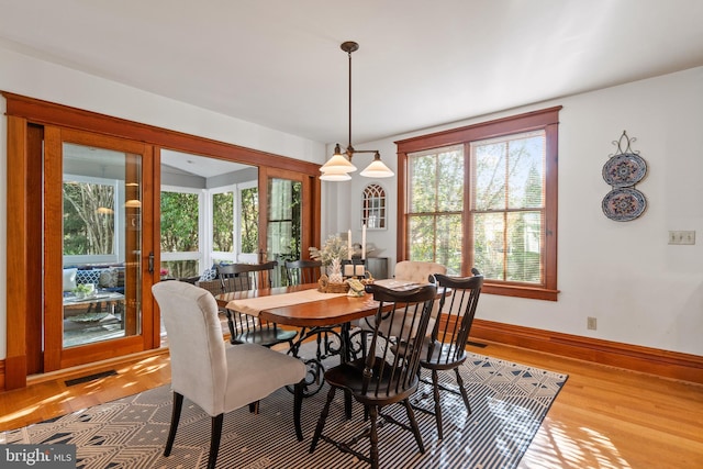 dining area featuring light wood-type flooring